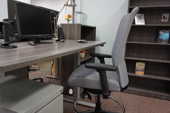 Gray designed office with sit-to-stand desk