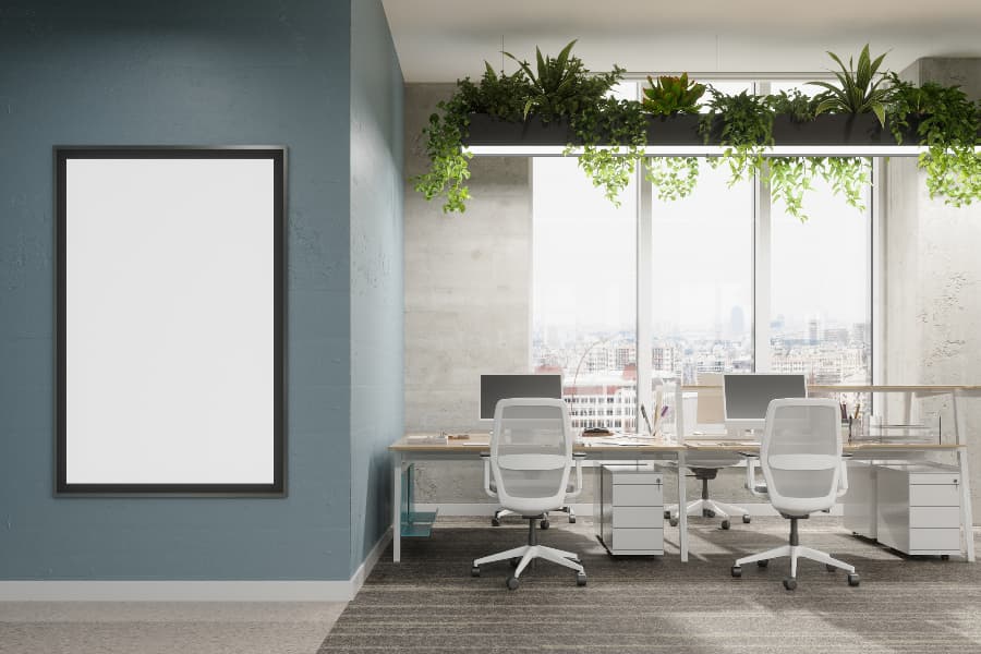Modern office with desks, chairs and plants